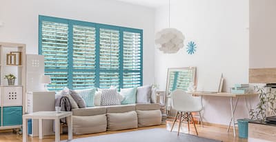 Teal painted wood shutters for a fun look