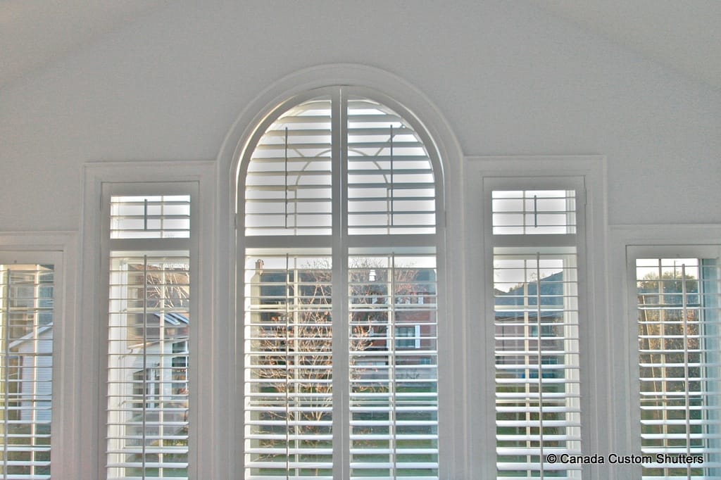 custom arched window shutters in white